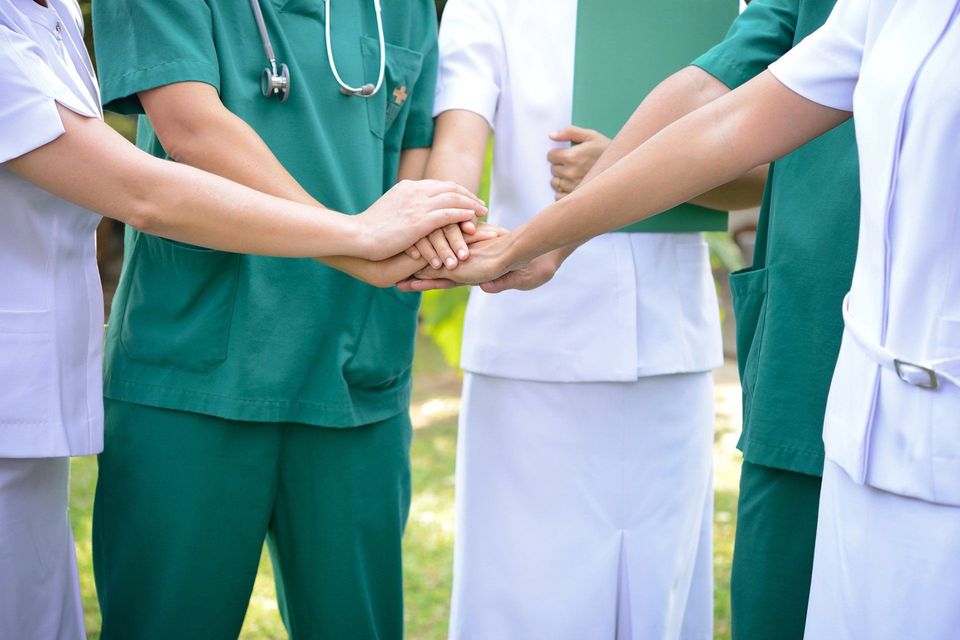 Nurses Putting Hands Together — Los Angeles, CA — Spiga and Associates