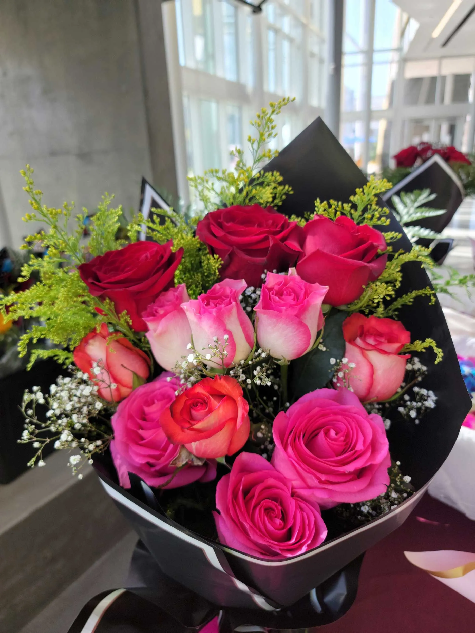 Pink flower and red roses