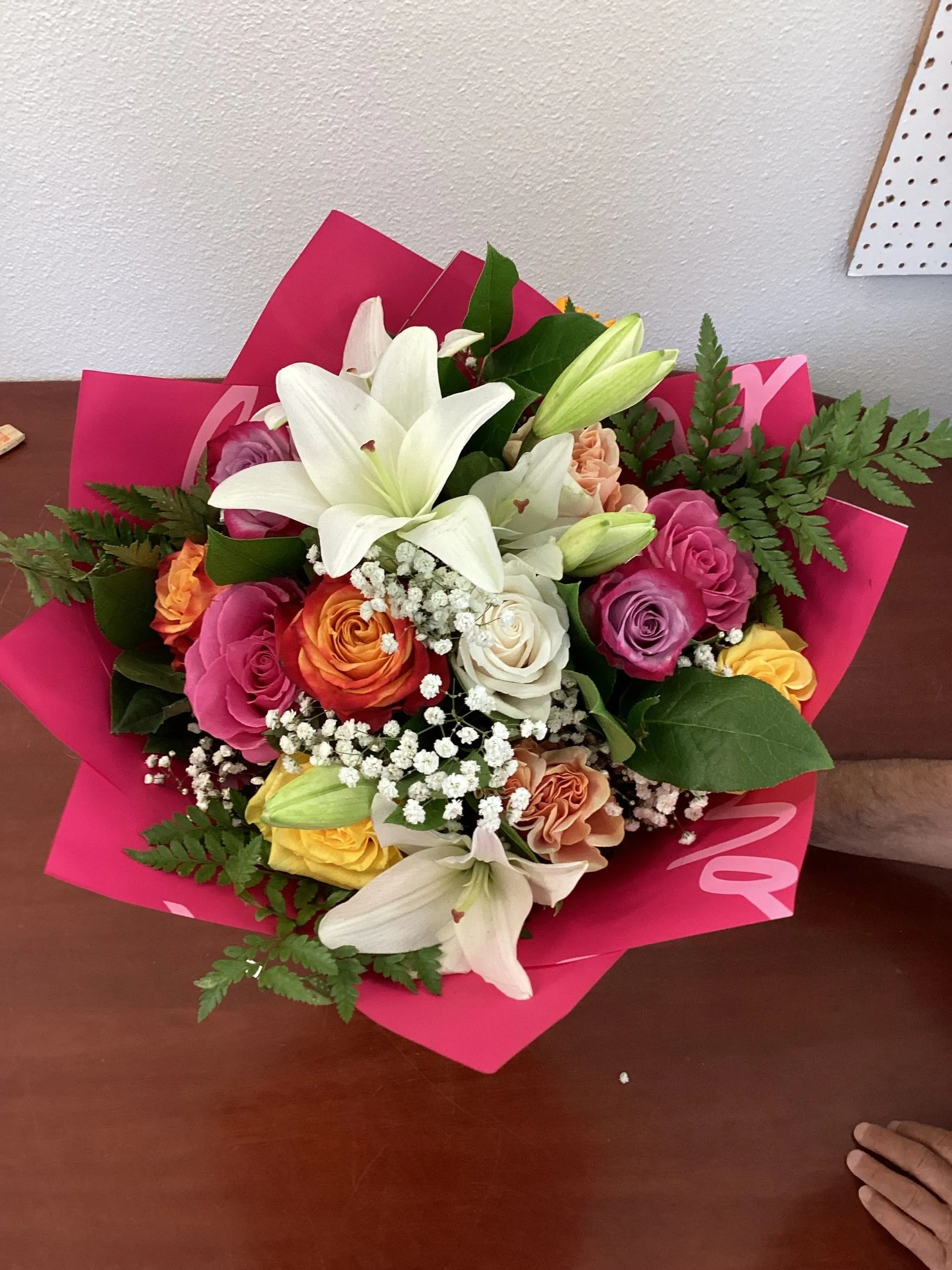 Bouquet of flowers wrapped in pink paper