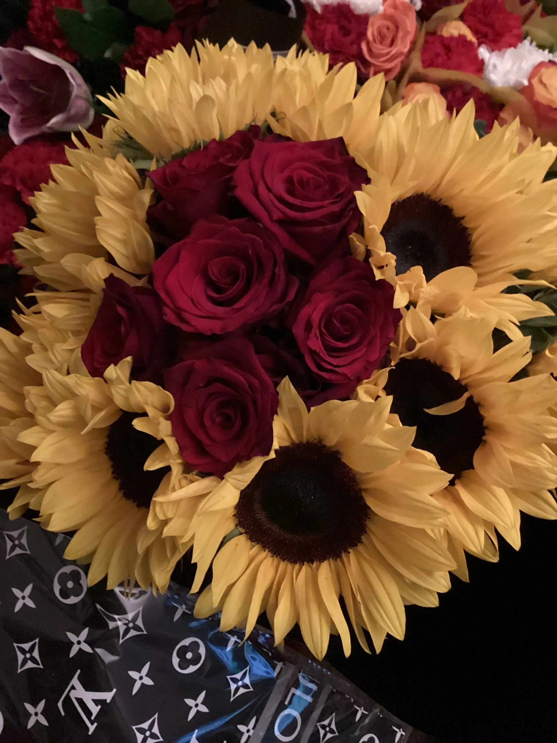 Sunflowers and red roses