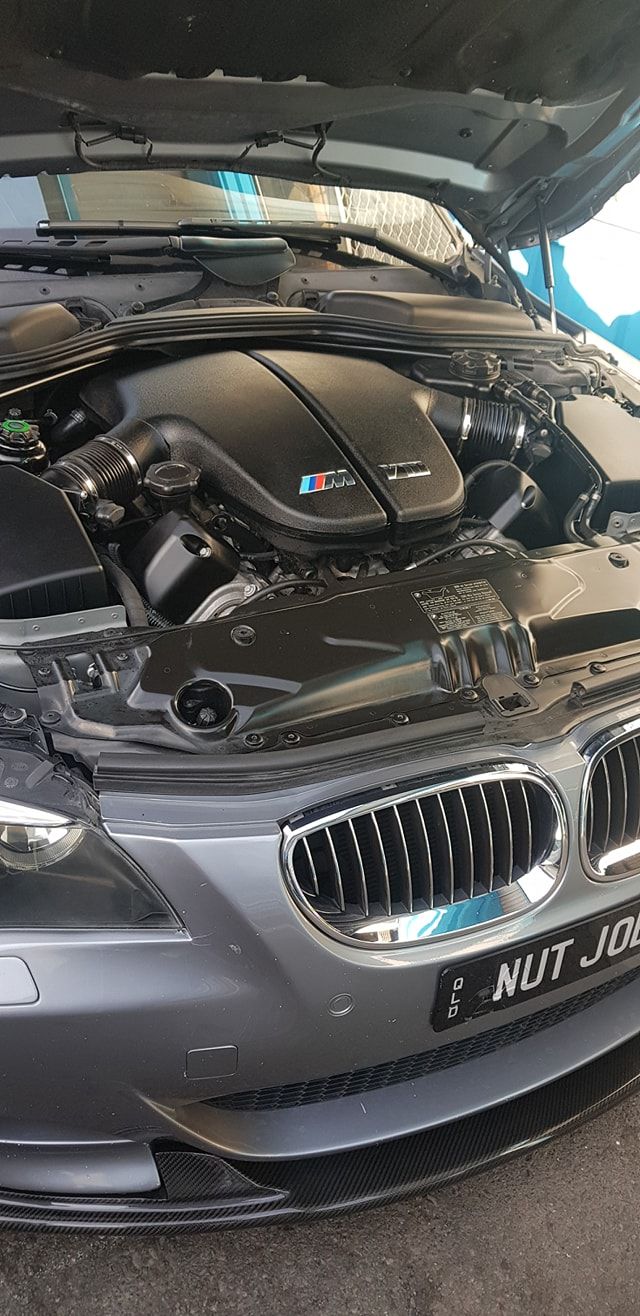 The Hood of a Bmw is Open and the Engine is Visible — Step Up Automotive in Southport, QLD