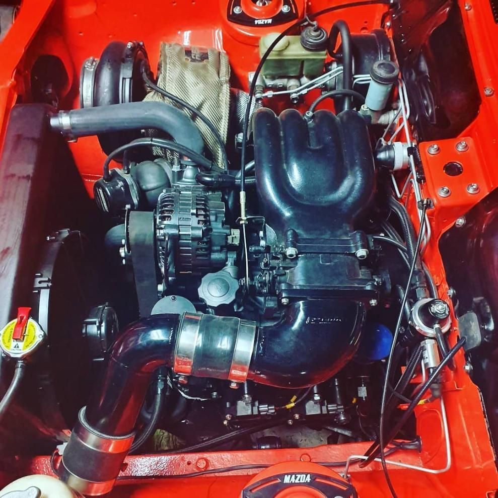 A Red Car With the Hood Open Has a Black Engine — Step Up Automotive in Southport, QLD