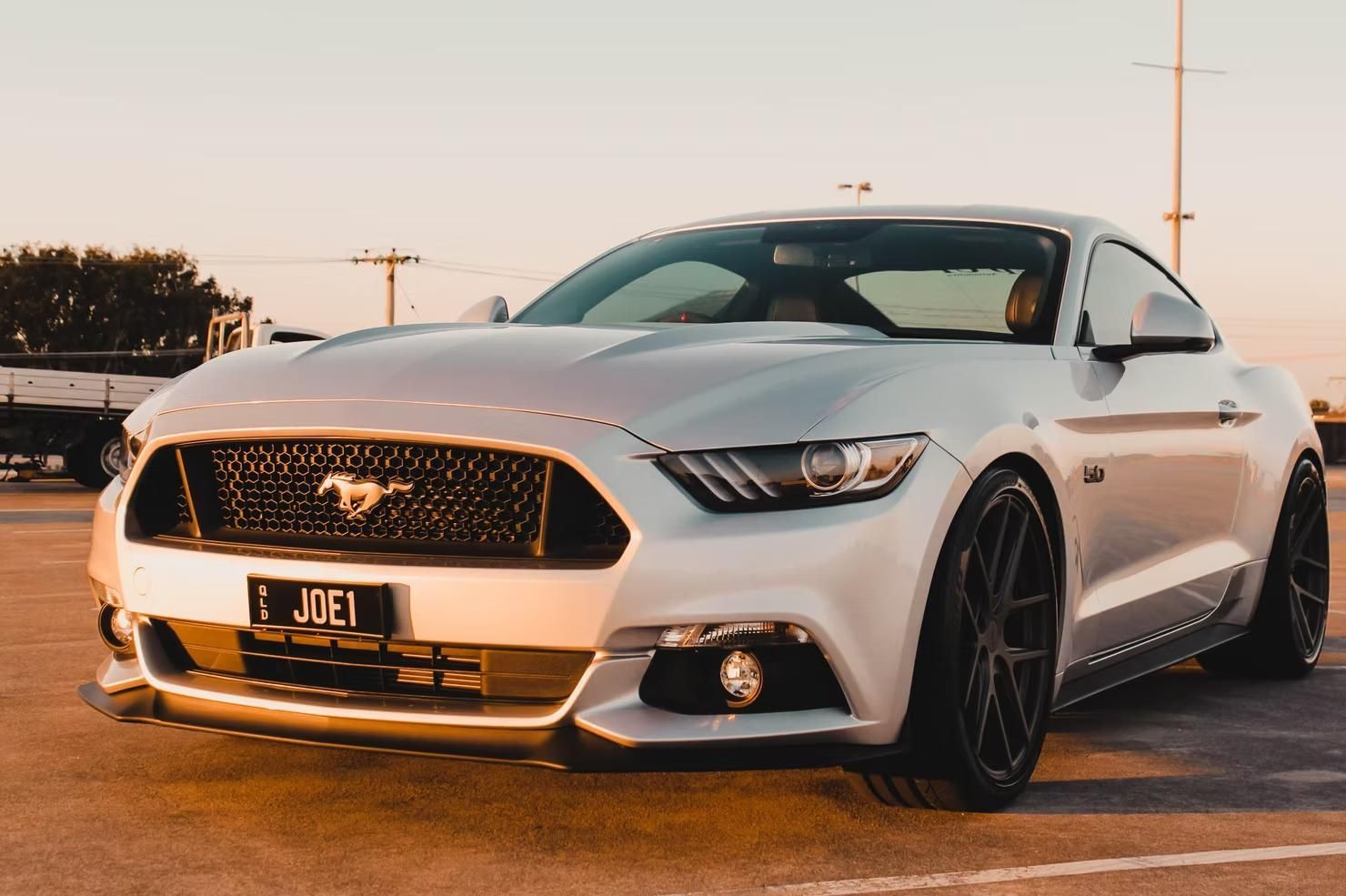 A White Ford Mustang is Parked in a Parking Lot — Step Up Automotive in Southport, QLD