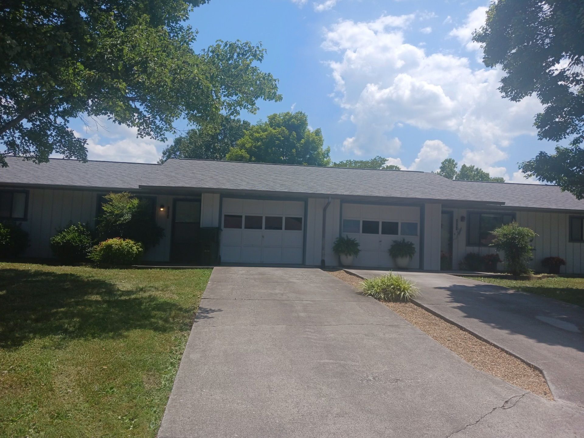 A house with two garage doors and a driveway