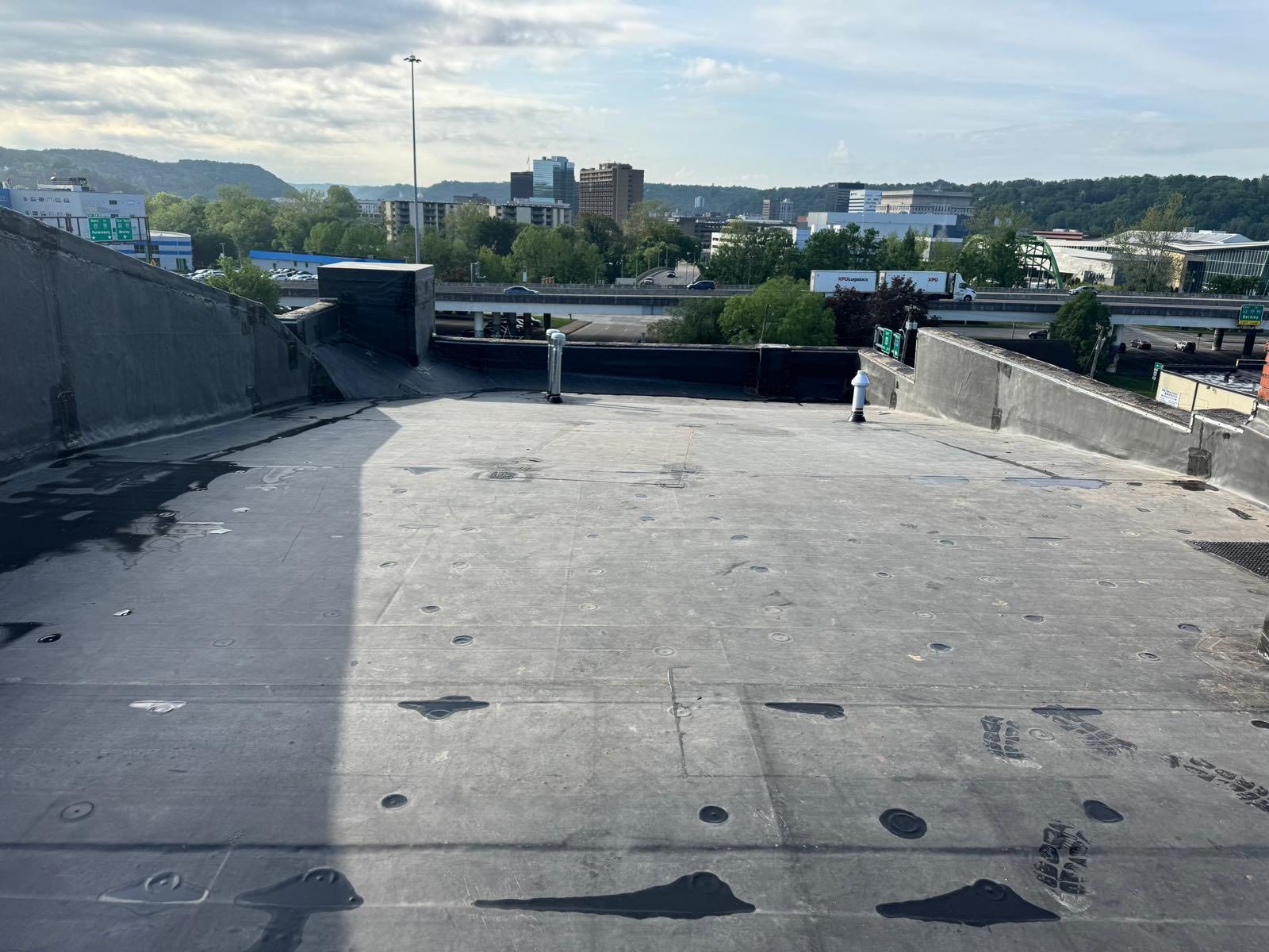 A view of a city from the roof of a building.