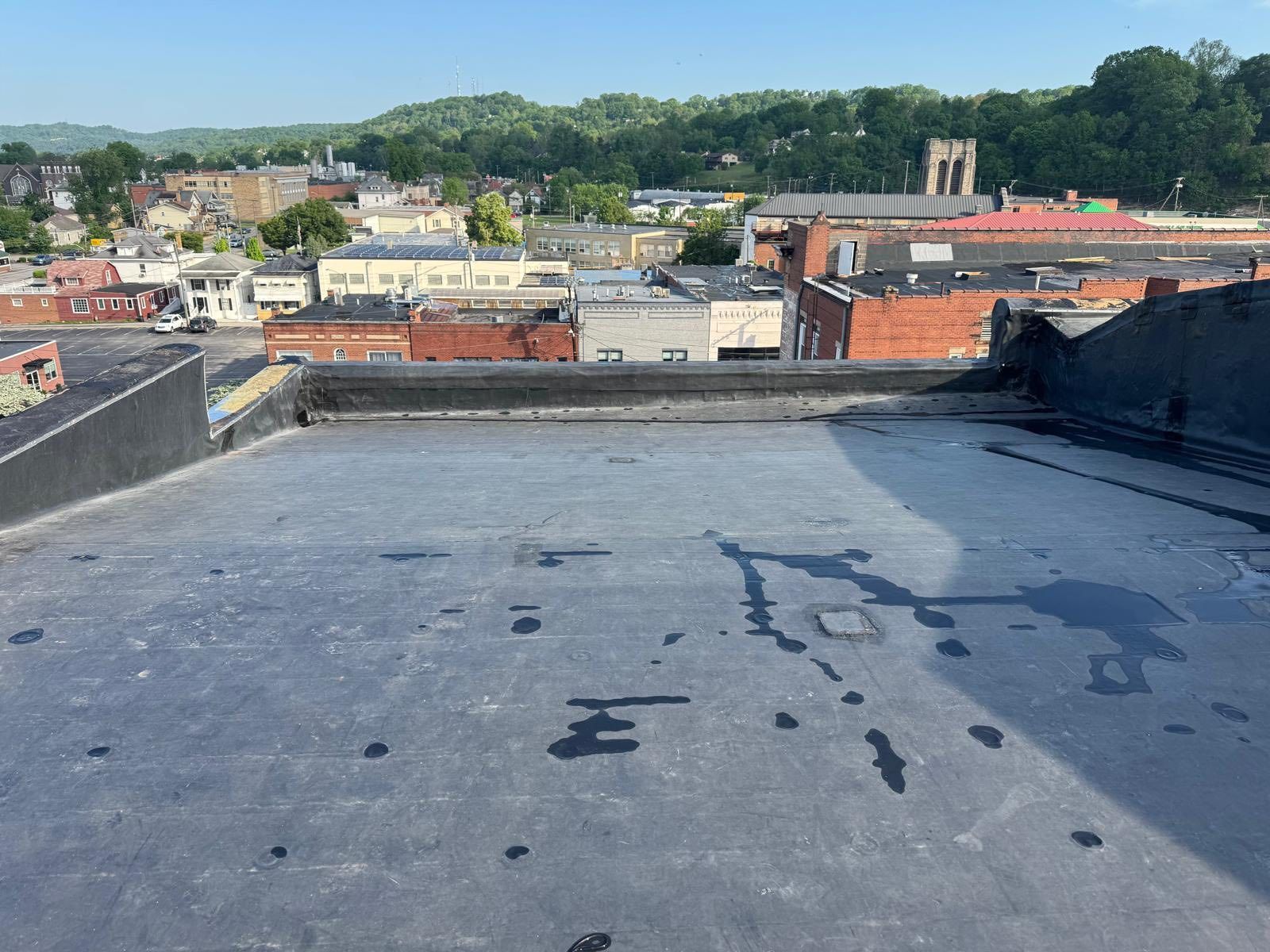 A view of a city from the roof of a building.