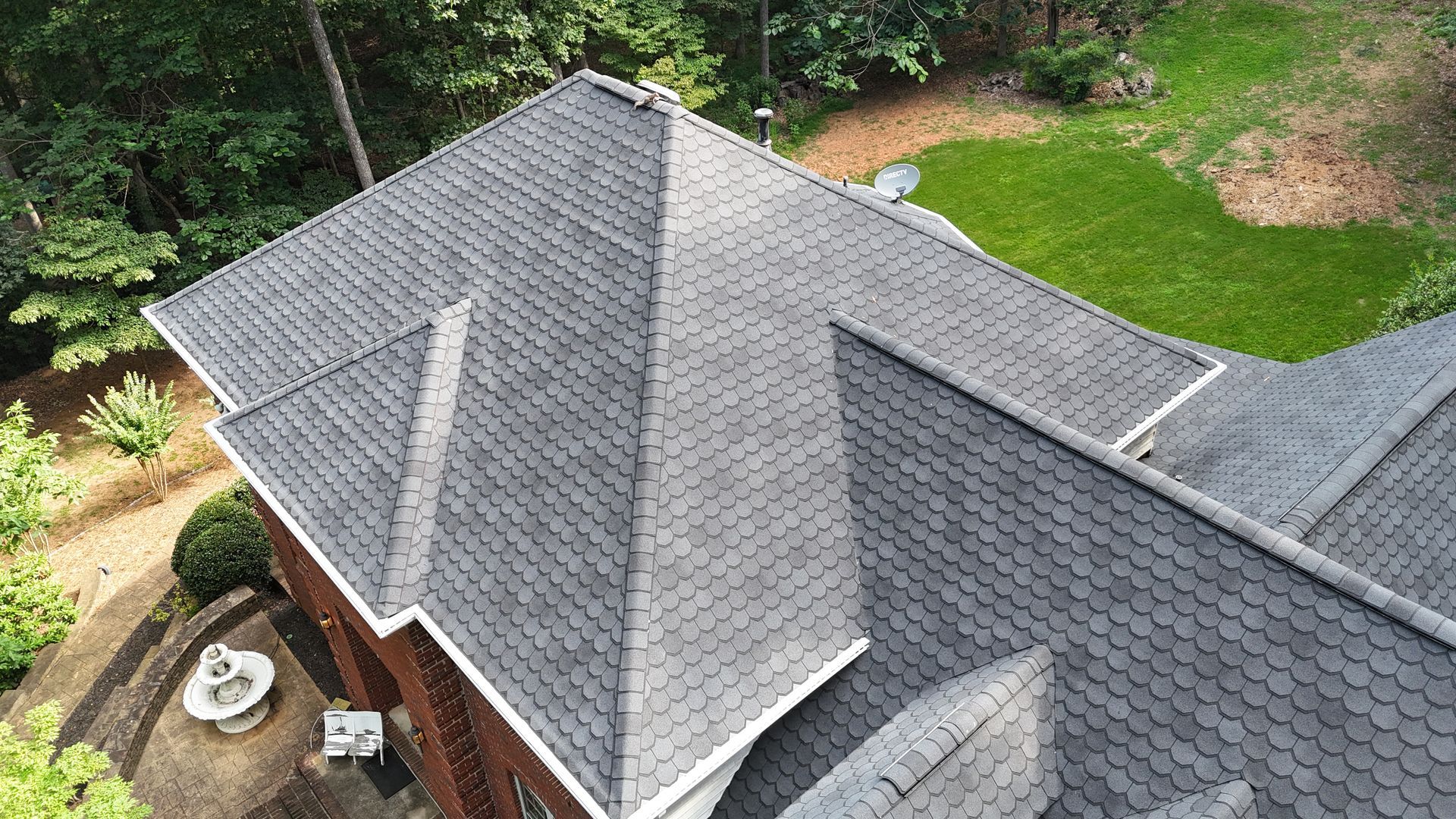 An aerial view of a roof of a house with a lot of shingles.