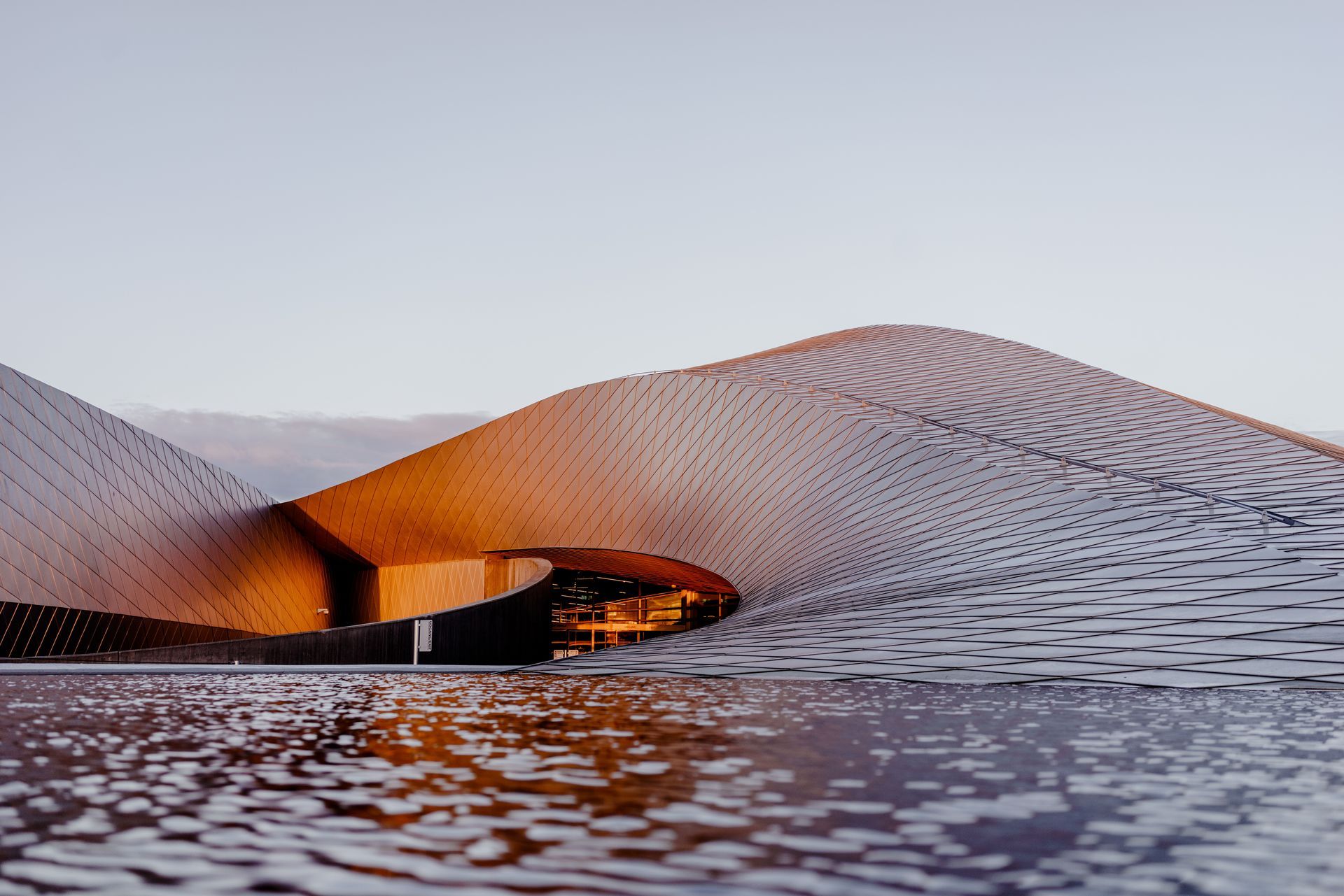 National Aquarium Denmark, Kastrup, Denmark architecture with light sky and orange light