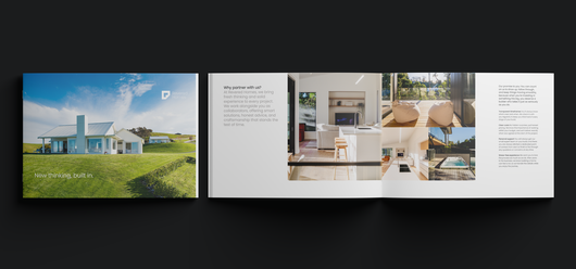 Brochure with a house on the cover, with interior design photos and text inside.