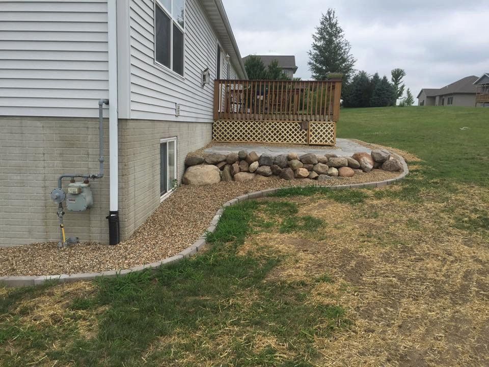 Backyard Stone Wall — Fairfax, IA — Ty's Snow Removal and Landscaping LLC