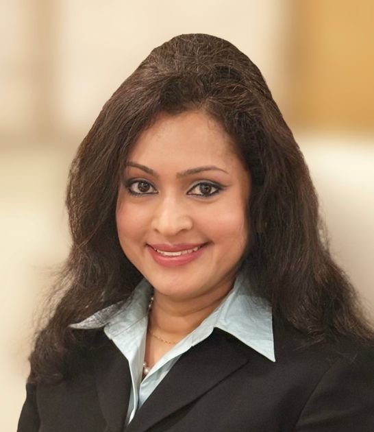 A confident woman who excels in building trust and maintaining strong relationships with clients, while consistently delivering results.