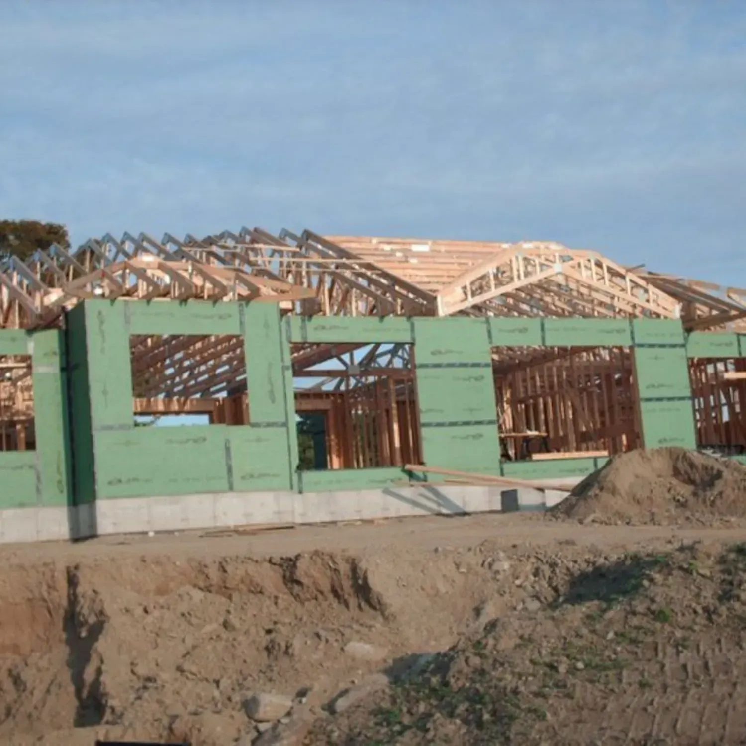 A house that is being built with green walls
