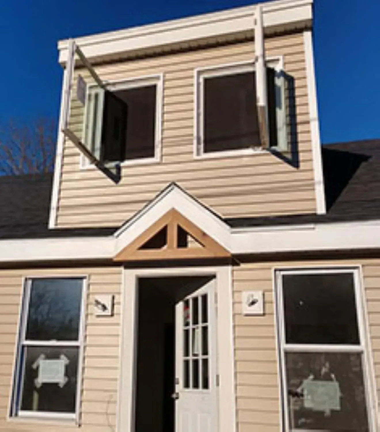The front of a house with the door open