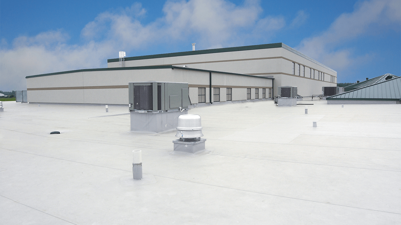 Flat roof on a commercial building is fabricated PVC.