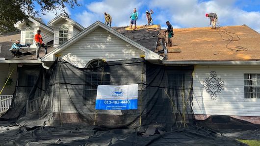A shingle roof being replaced by the Nations R & C roofers.