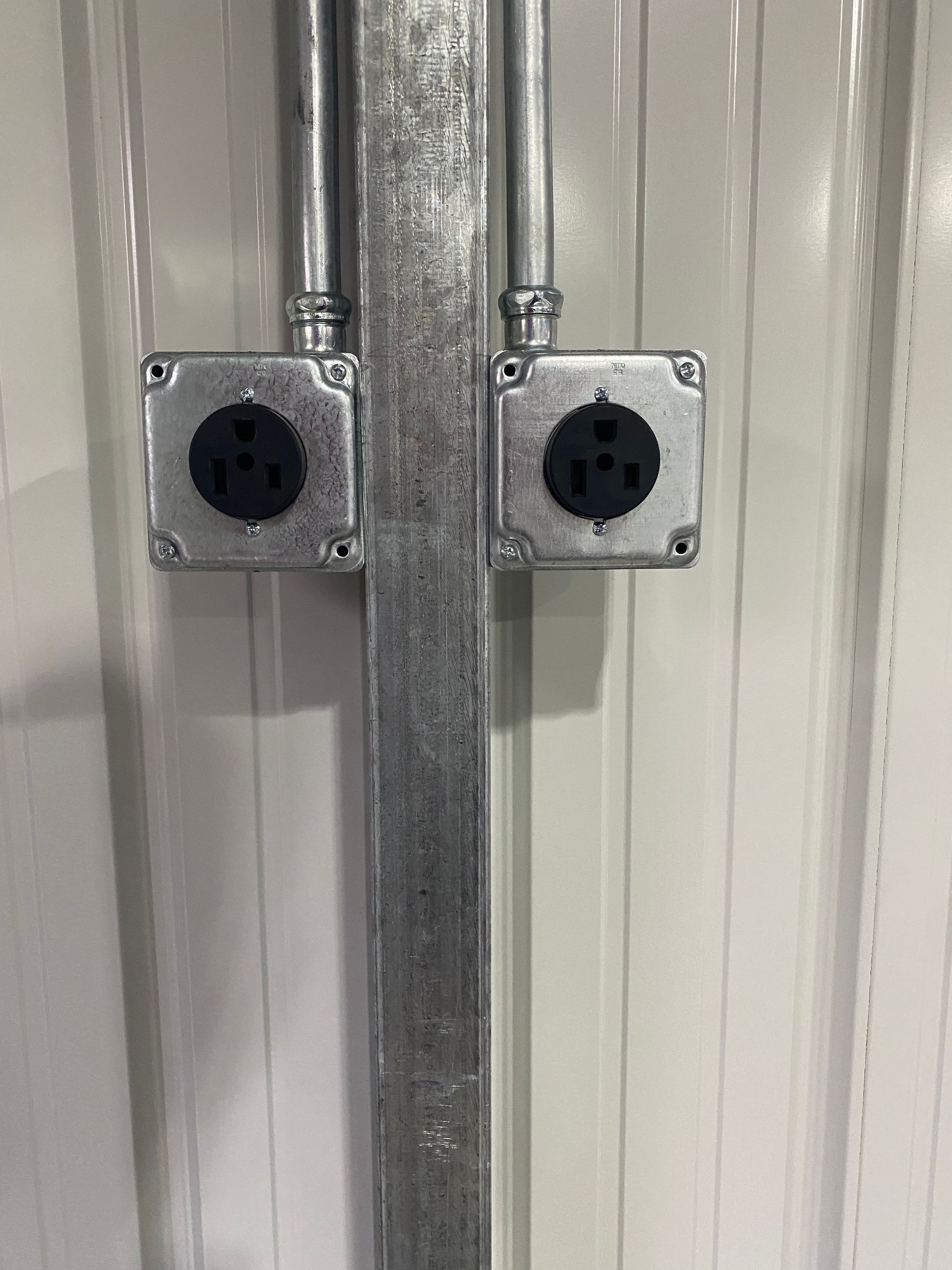 There are two electrical outlets on the wall.