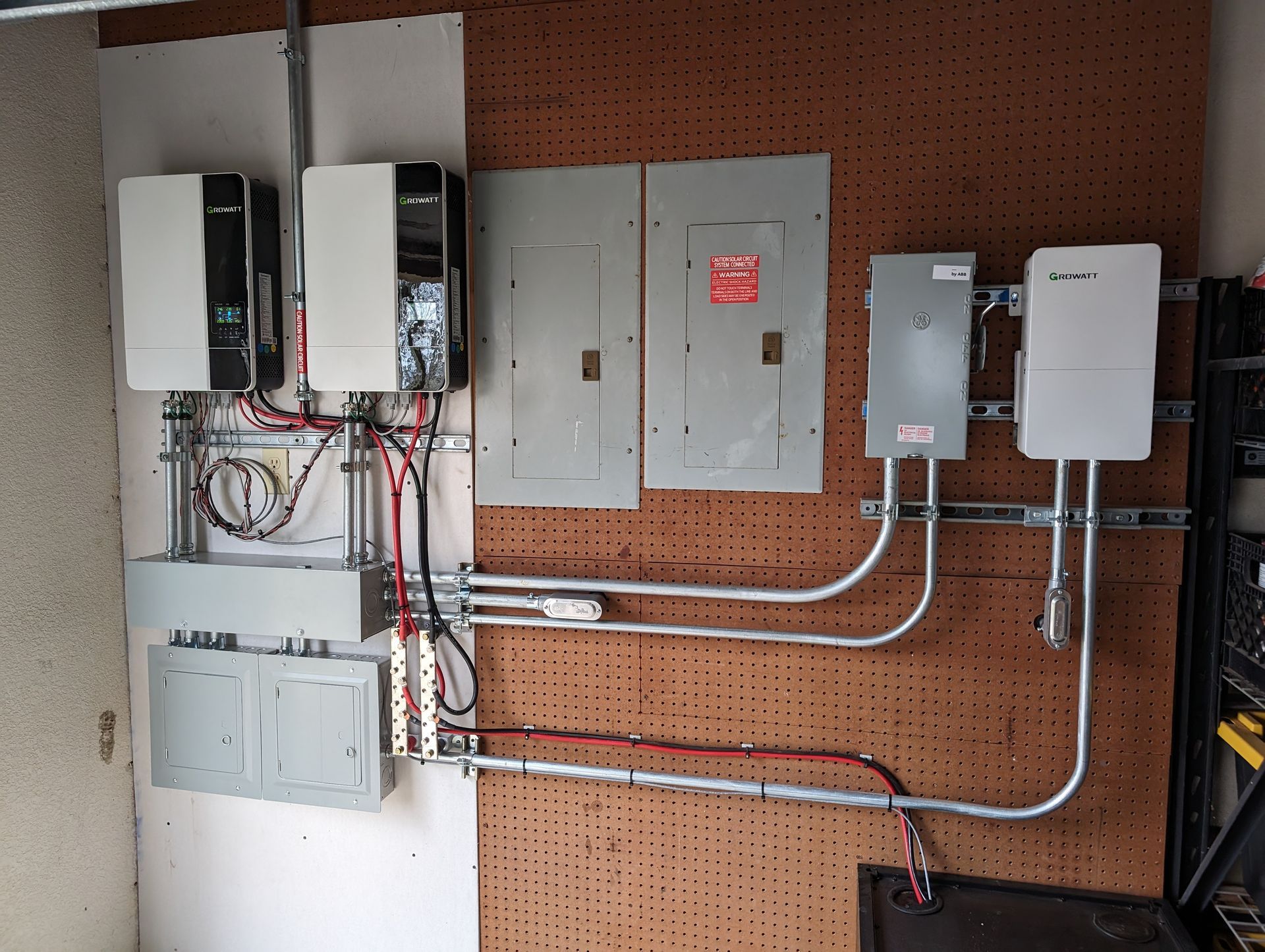 A wall with a solar inverters on it