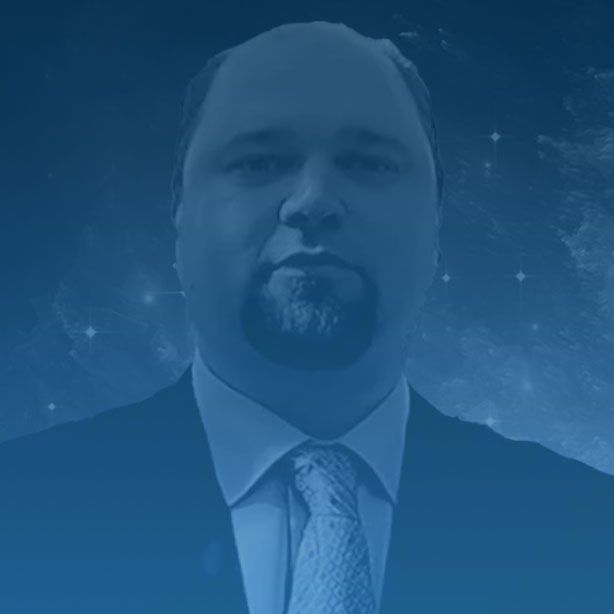 Robin Knight, a man with a beard is wearing a suit and tie.