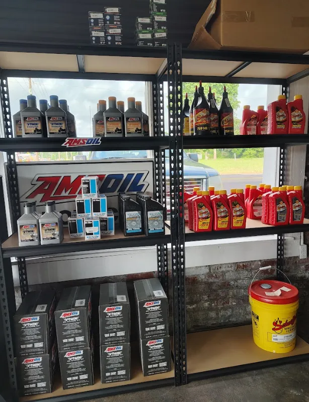 Shelves stocked with various AMSoil oil products.