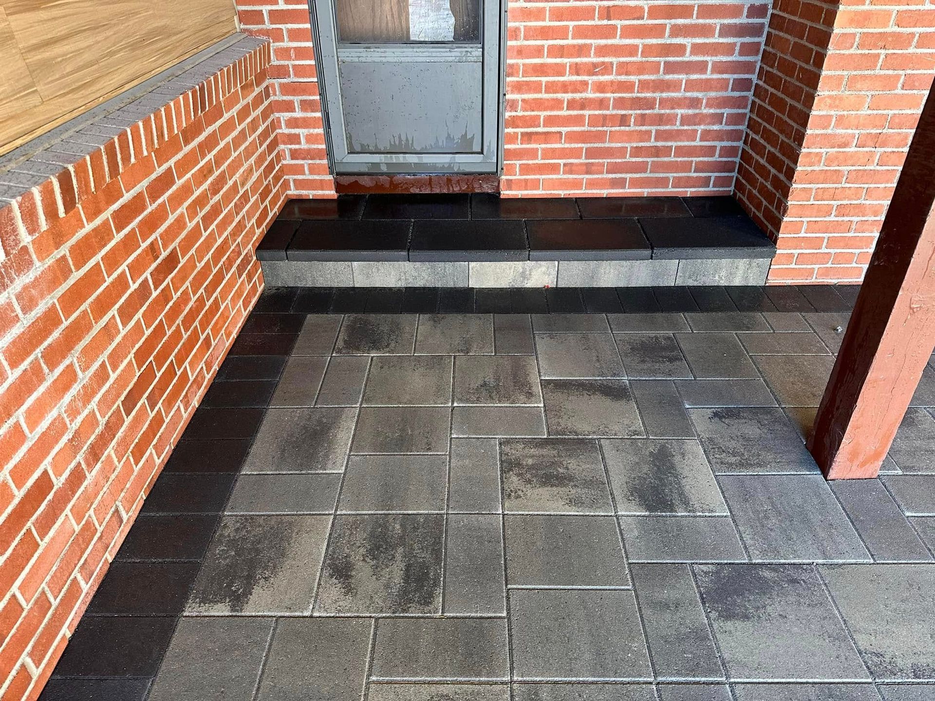 A brick building with a patio in front of it