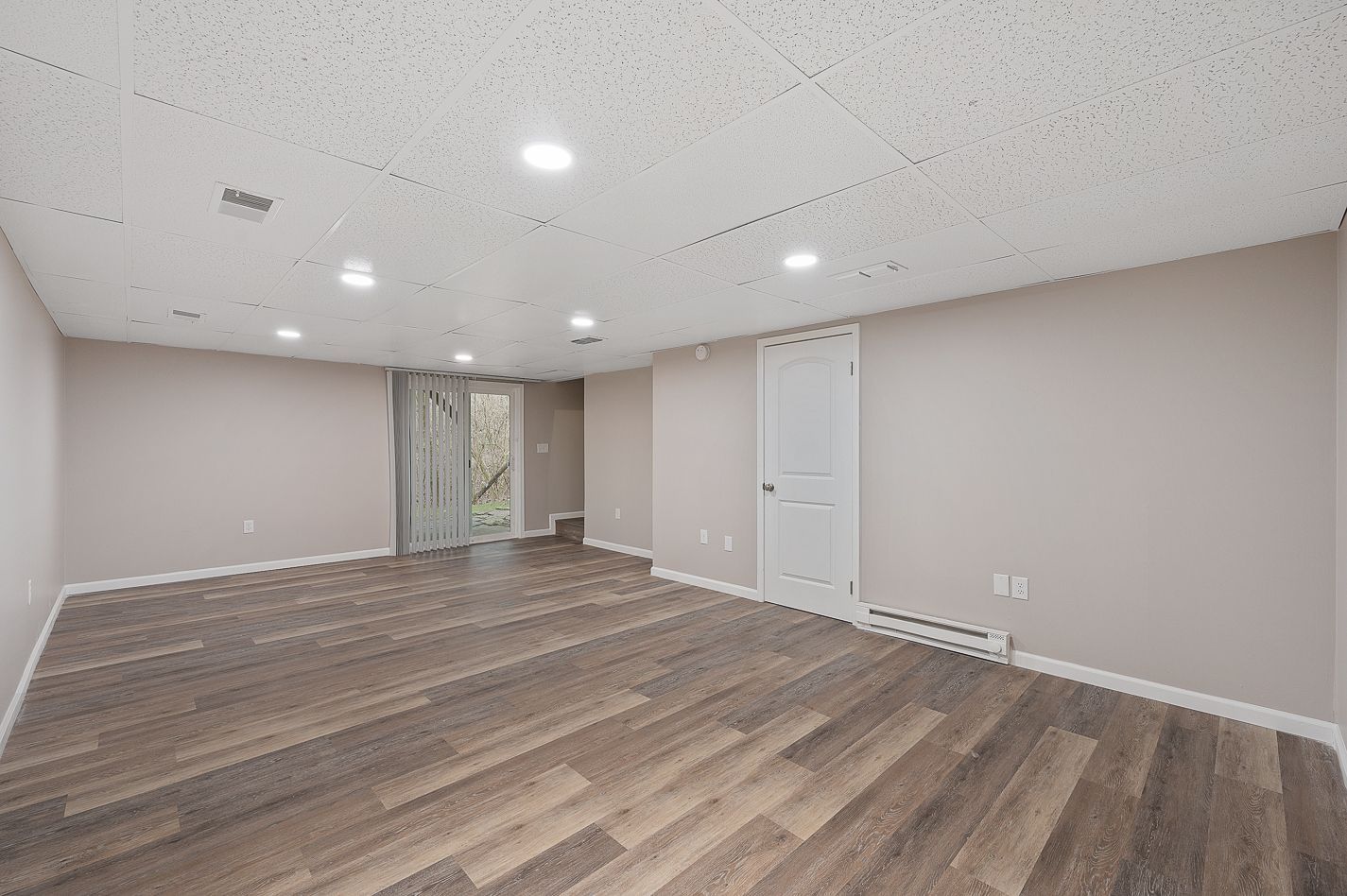 Image of a spacious living room space with LVP flooring