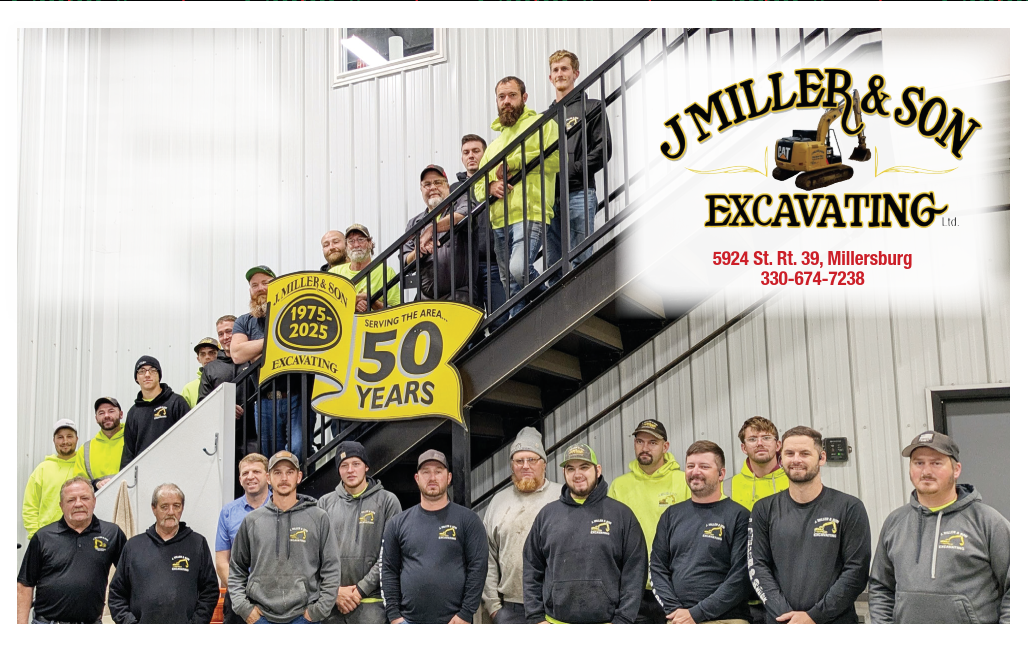 Group of employees from J. Miller & Son Excavating celebrating 50 years. They are standing near a staircase.