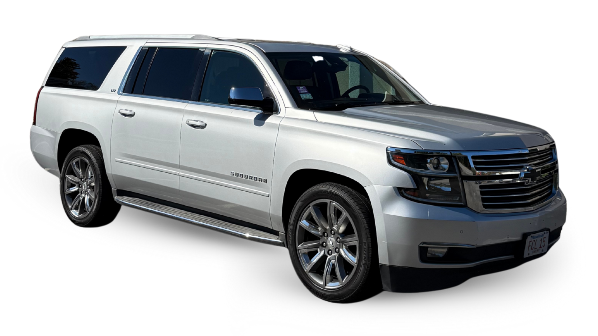 White Chevrolet Suburban SUV on a white background.