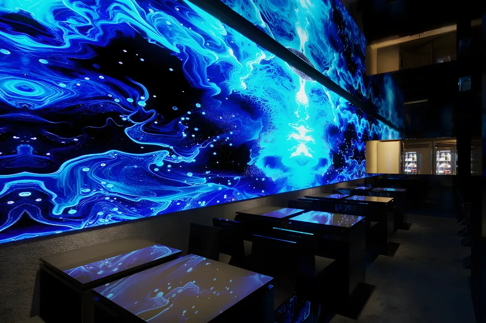 Futuristic restaurant interior with glowing blue abstract art on a large wall, reflecting on sleek black tables, creating a dynamic ambiance.