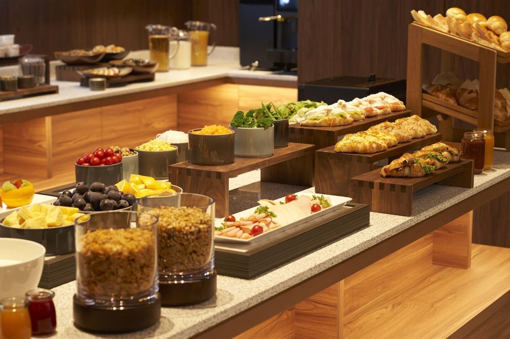 An extensive buffet with a variety of food options available at Cross Life Hakata Tenjin.