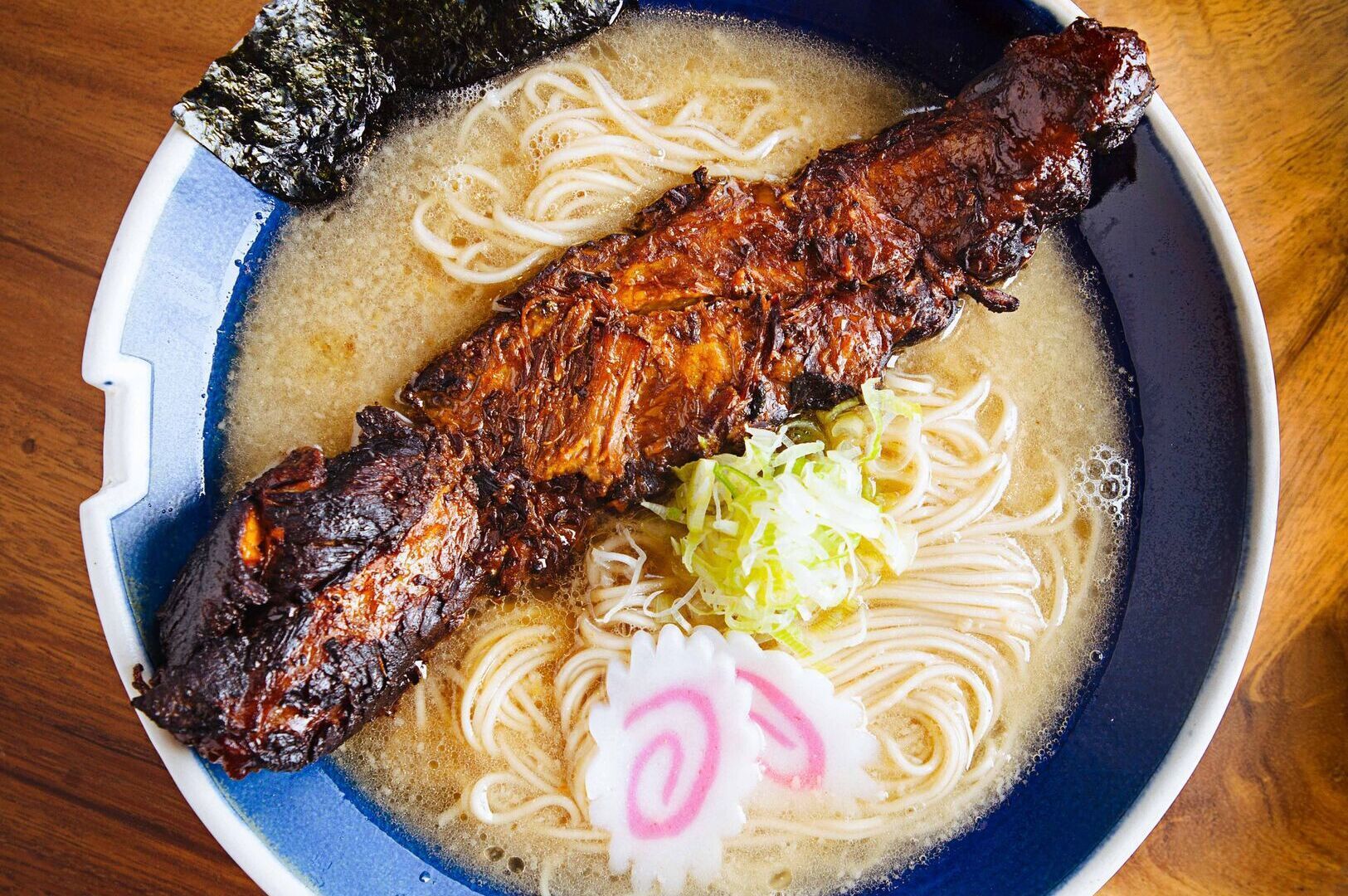 A bowl of Hanamaruken Ramen featuring rich noodles and tender meat.