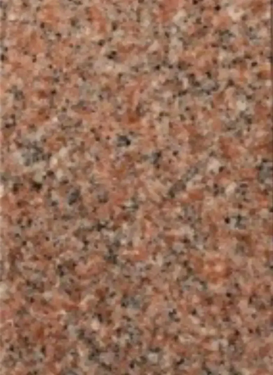 A close up of a pink granite counter top.