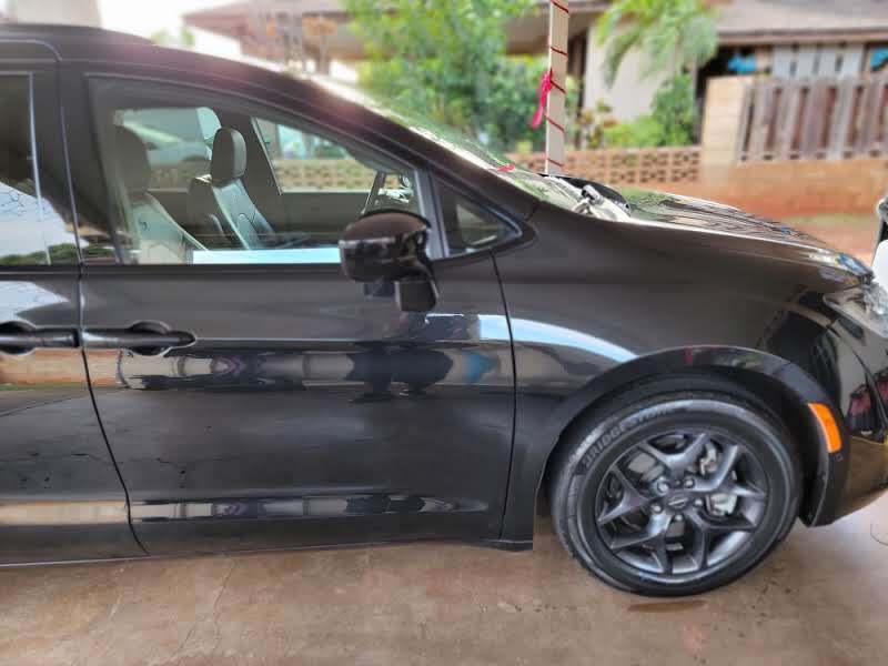 Black Chrysler Pacifica minivan parked outdoors.