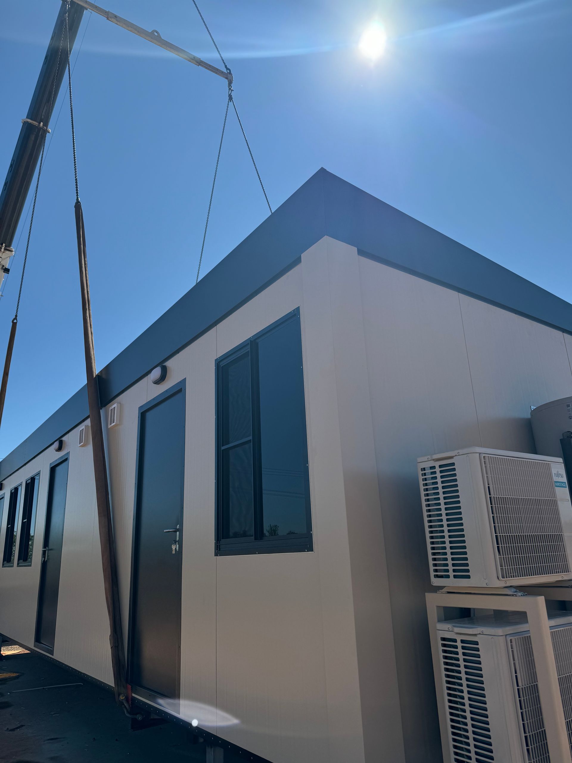 Modular building being placed by a crane