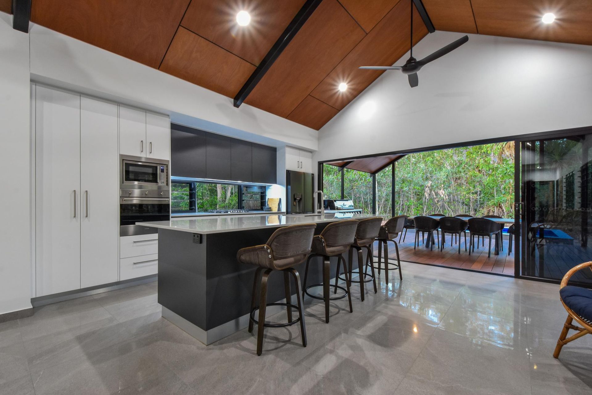 Modern kitchen with large door opening to balcony