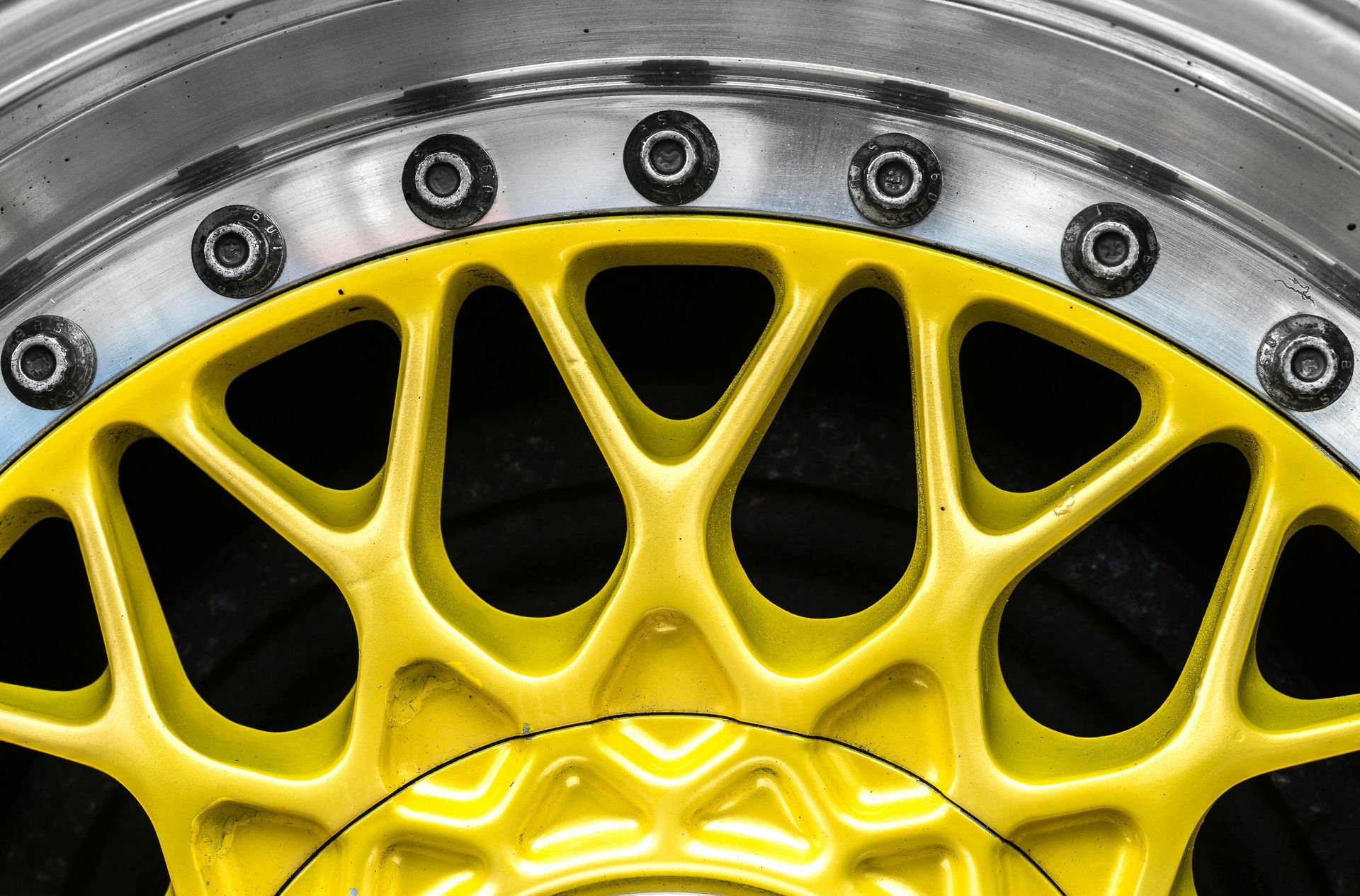 Yellow powder-coated wheel rim showing durable, vibrant finish from professional powder coating