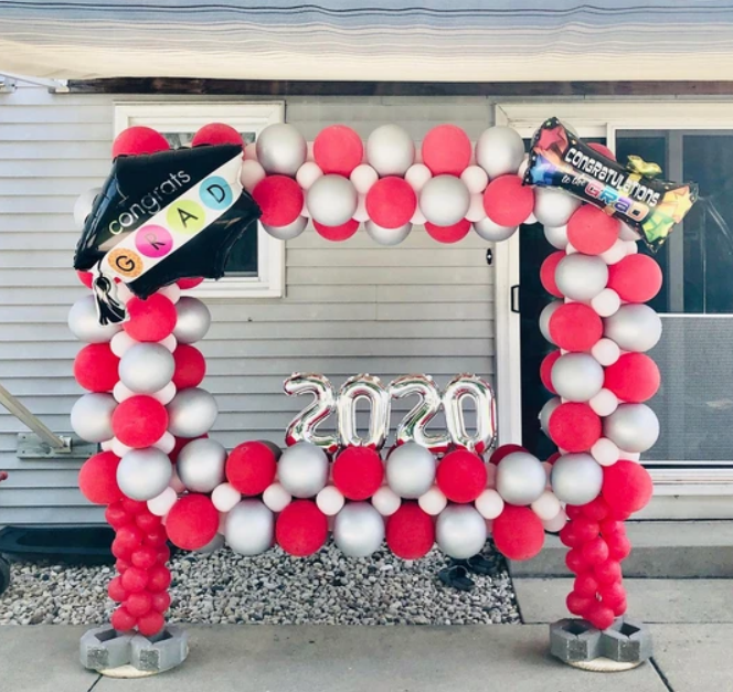 A frame made of red and white balloons with the year 2020