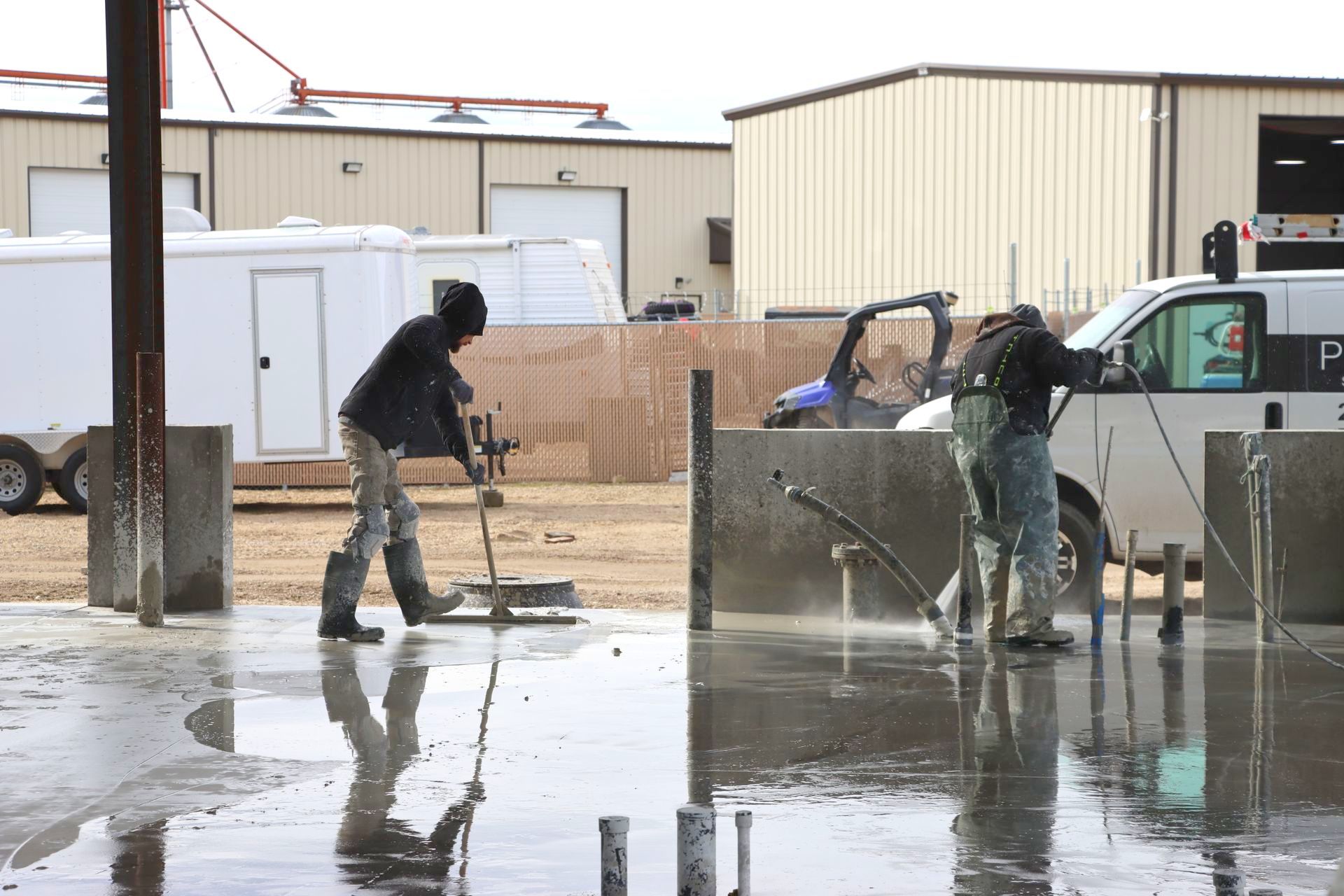 A group of men are cleaning the floor of a building