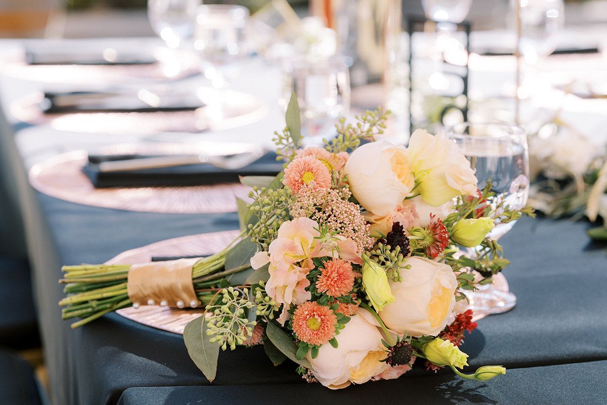 A bouquet of flowers is sitting on a table.