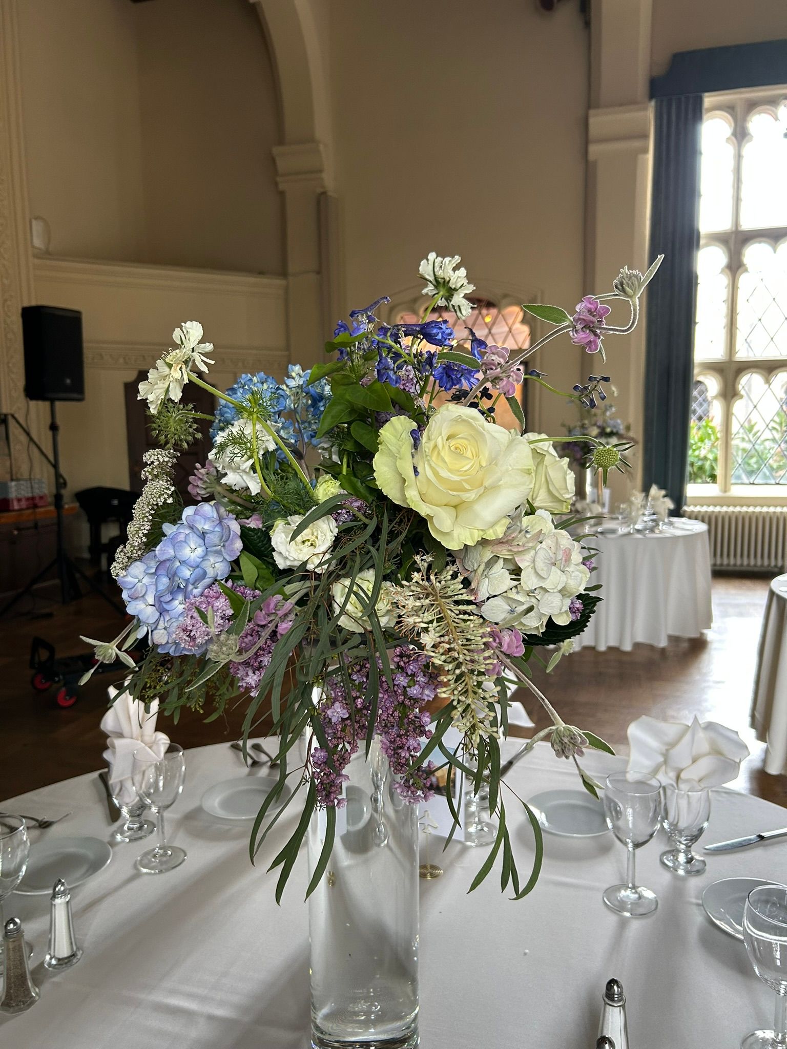 A tall centerpiece in blues and purples