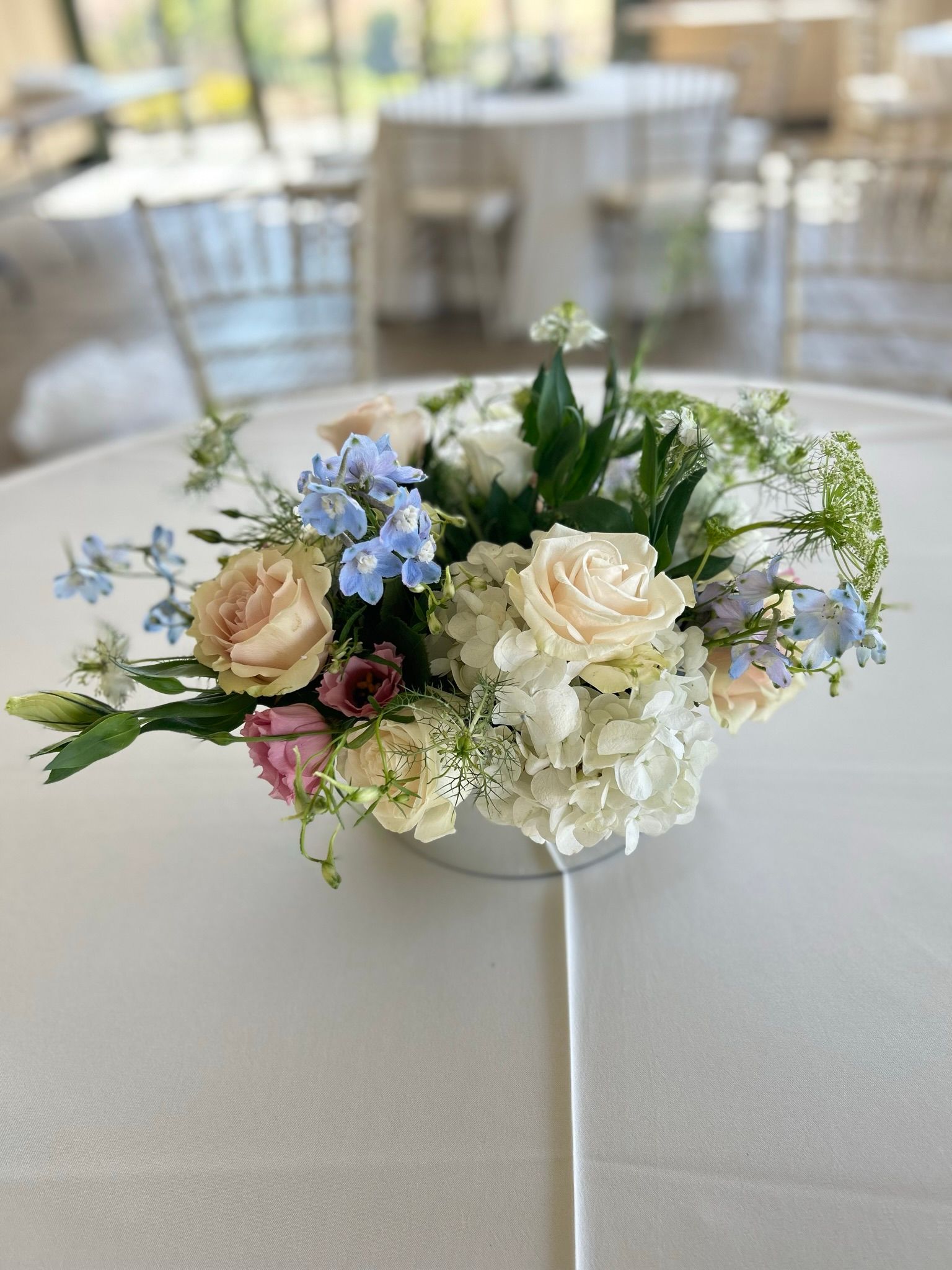 A vase filled with flowers is sitting on a table.
