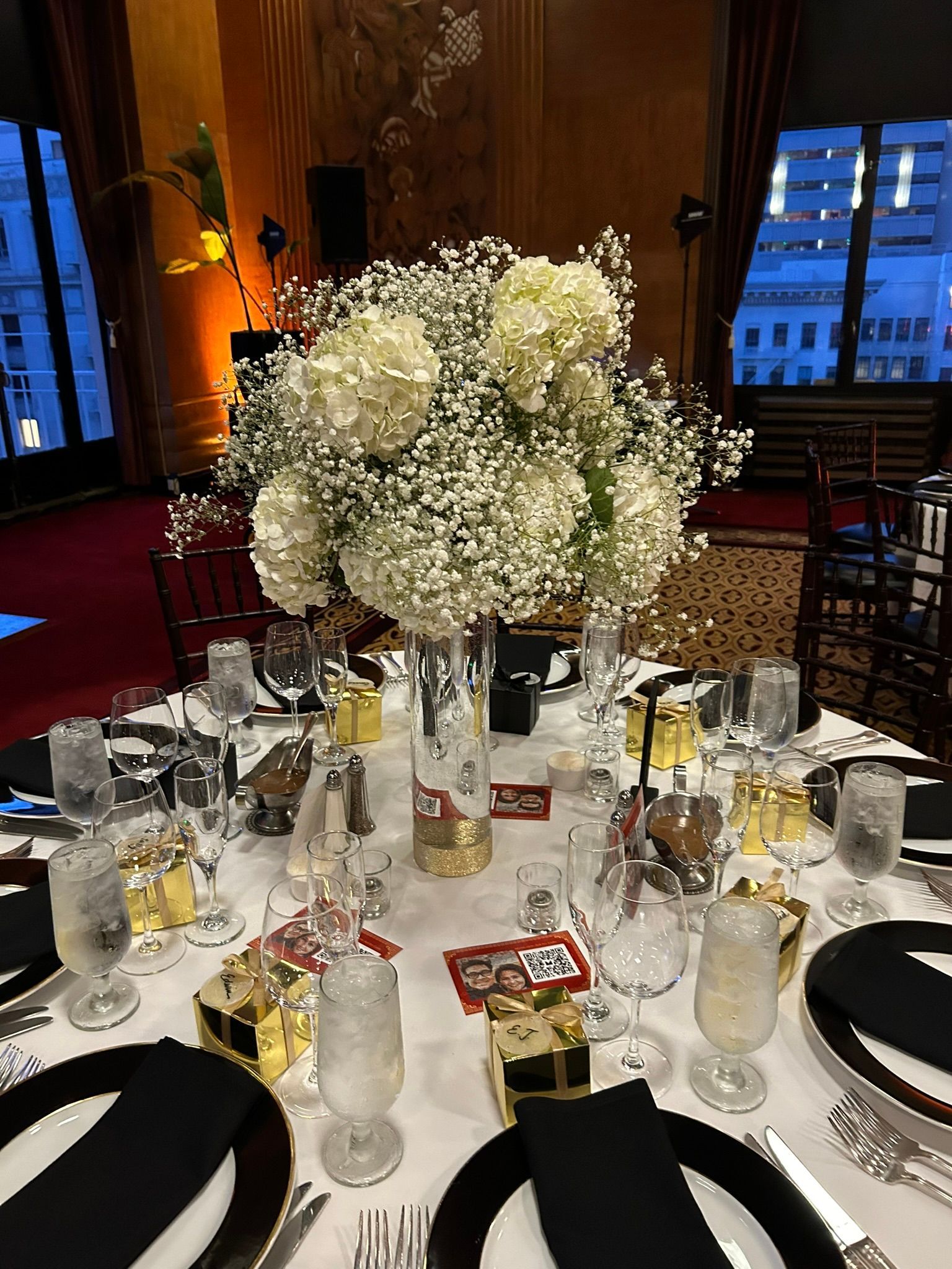 Tall wedding centerpiece with baby's breath and hydrangeas