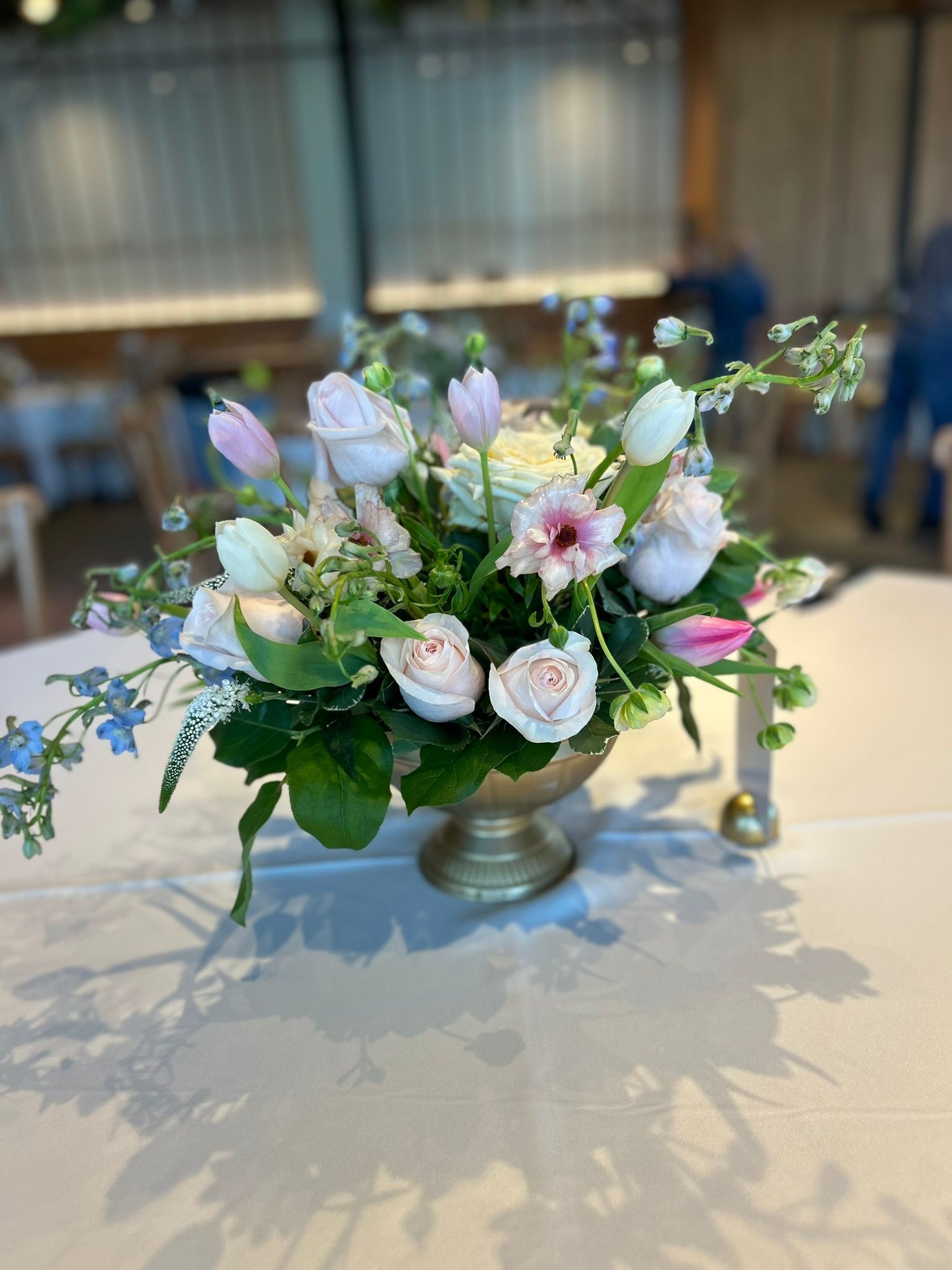 A gold vase spring centerpiece