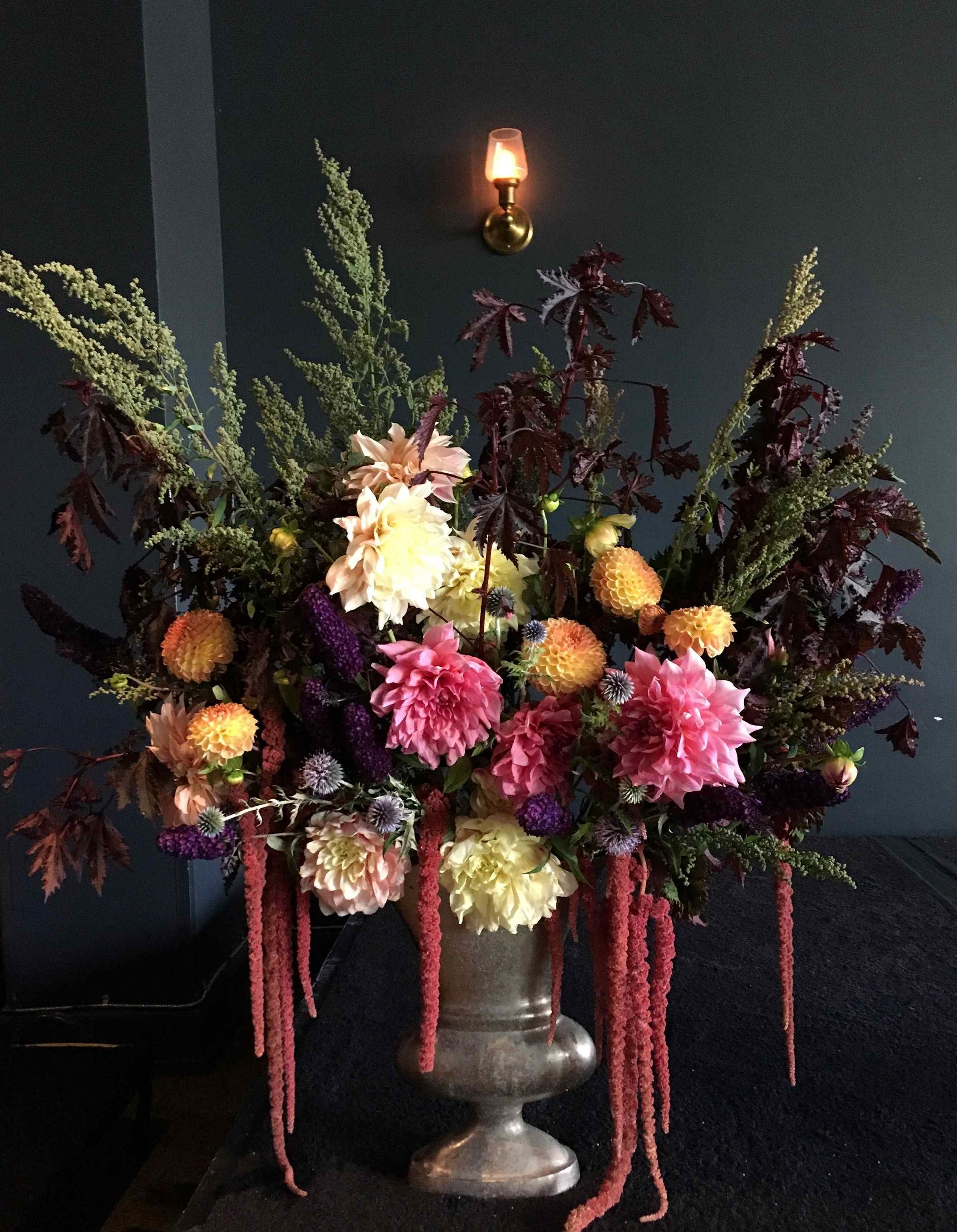 A vase filled with flowers is sitting on a table.