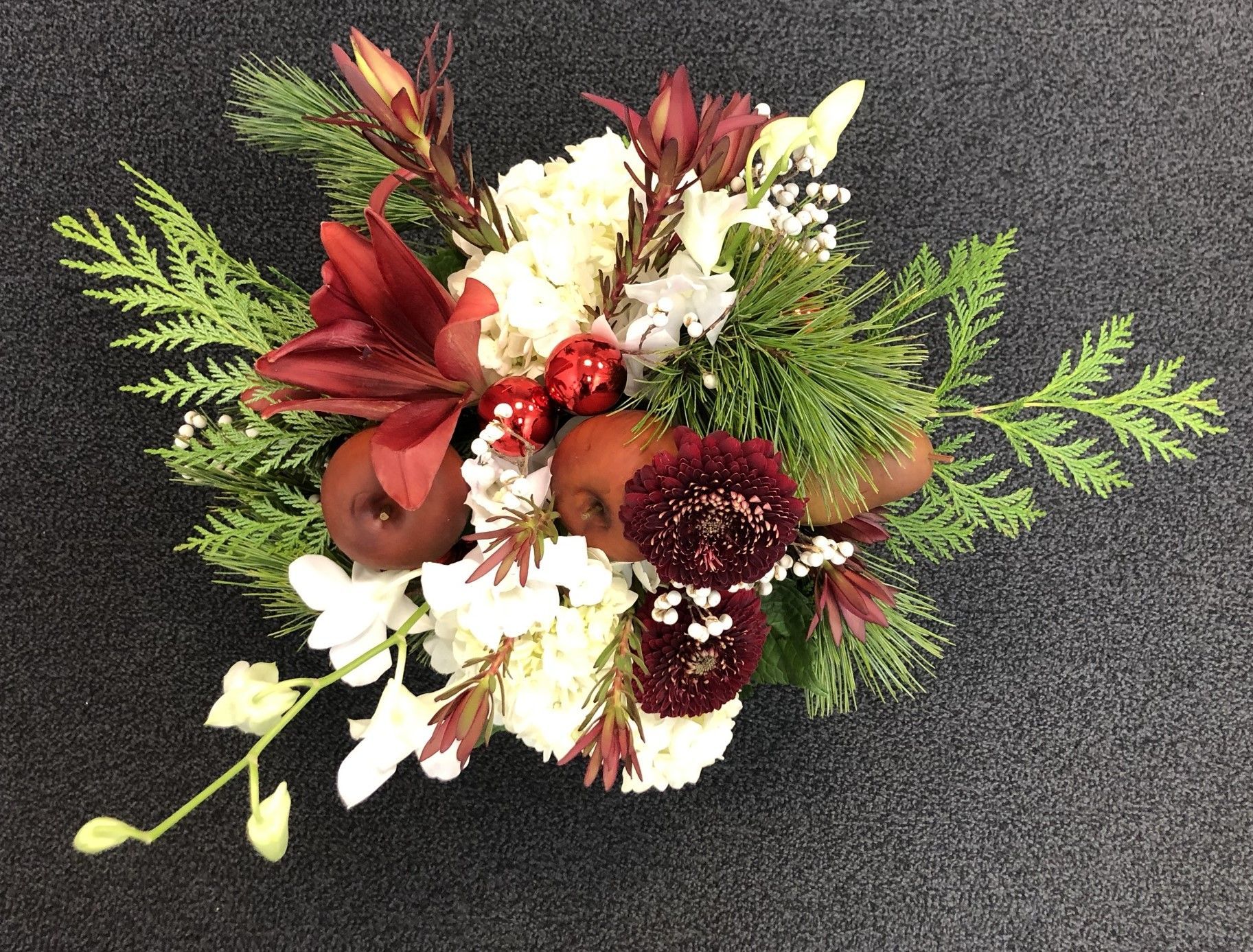 A Christmas bouquet of flowers and fruit 