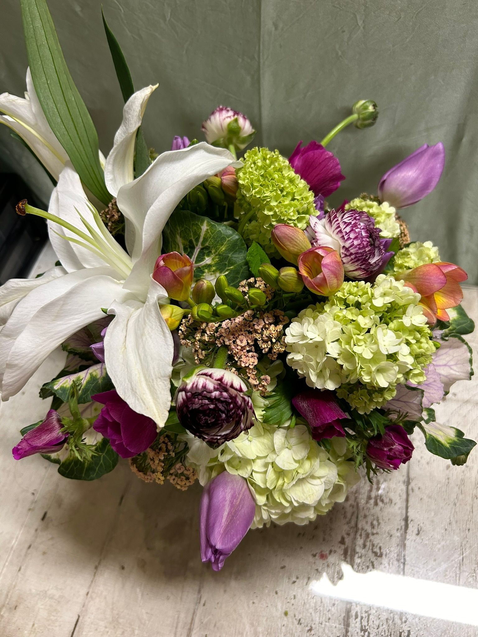 A bouquet of flowers is sitting on a table.
