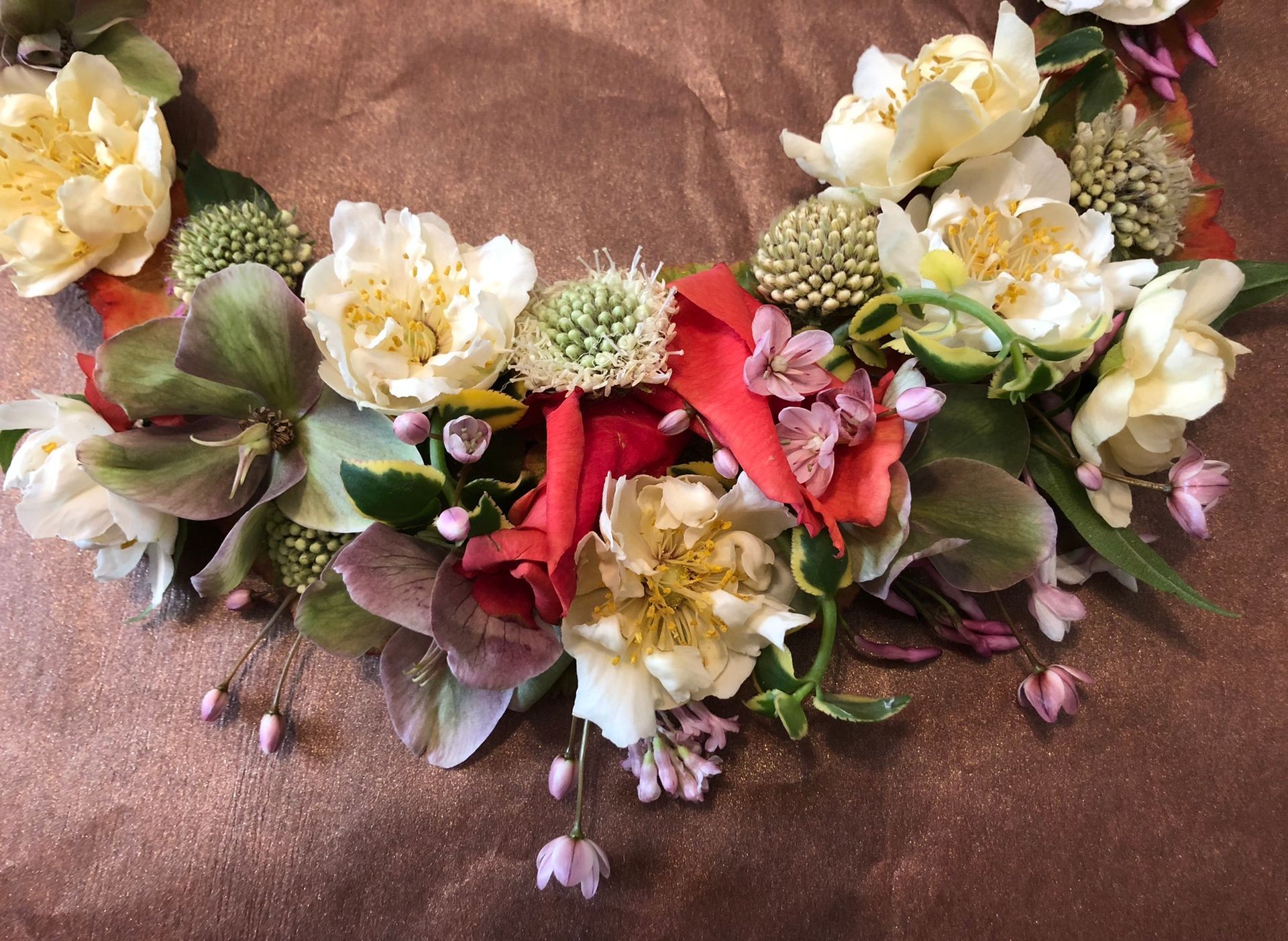 A close up of a wreath of flowers on a table