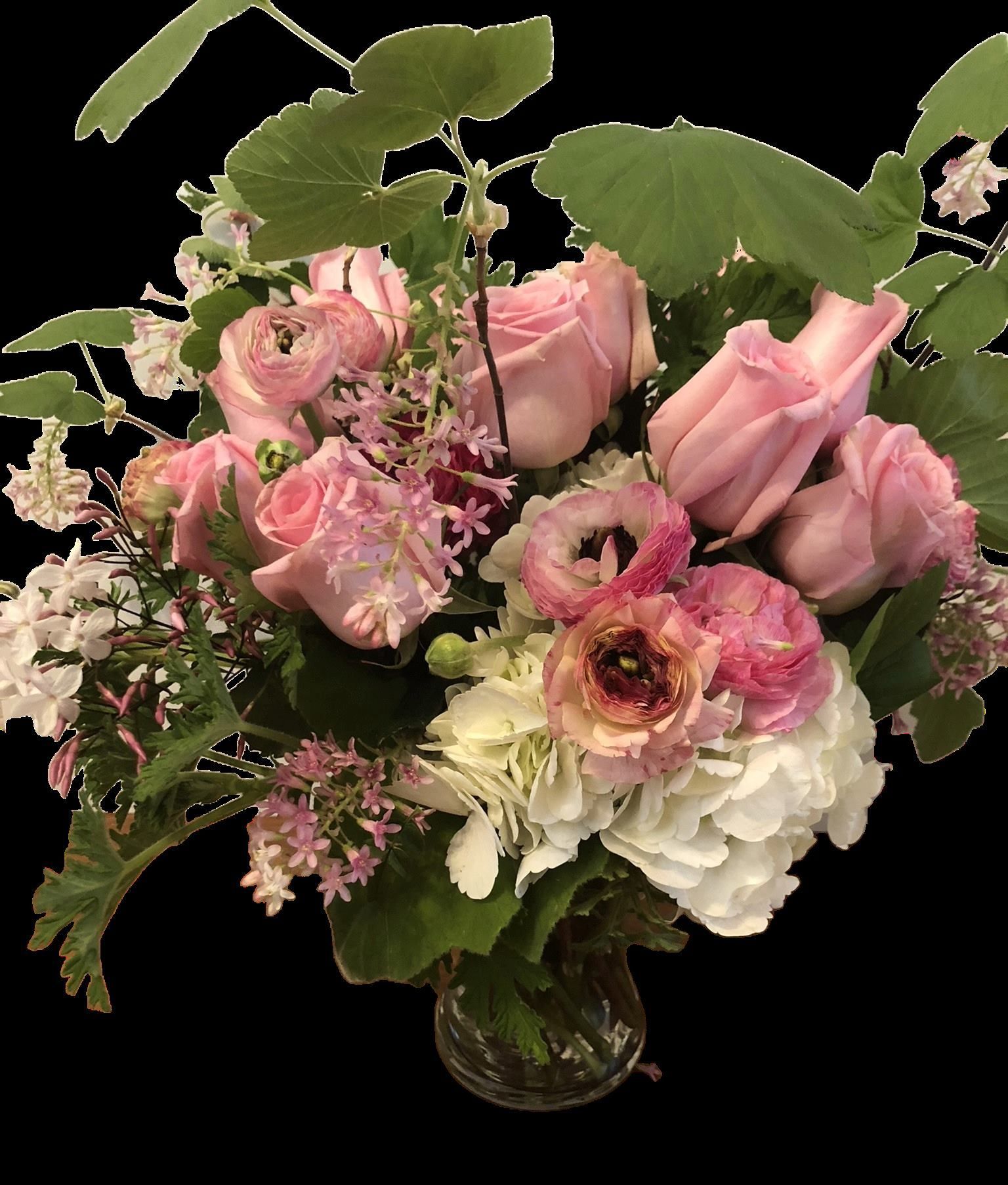 A vase filled with pink and white flowers on a black background