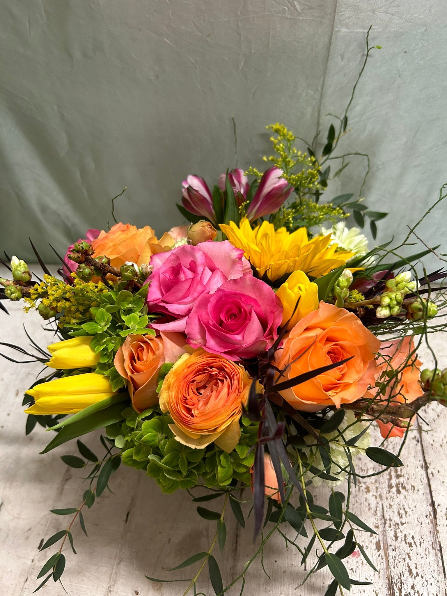A bouquet of flowers is sitting on a table.