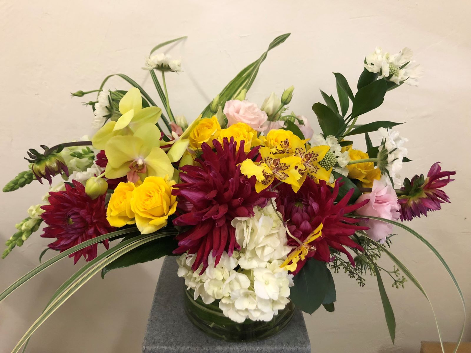 A vase filled with flowers is sitting on a table.