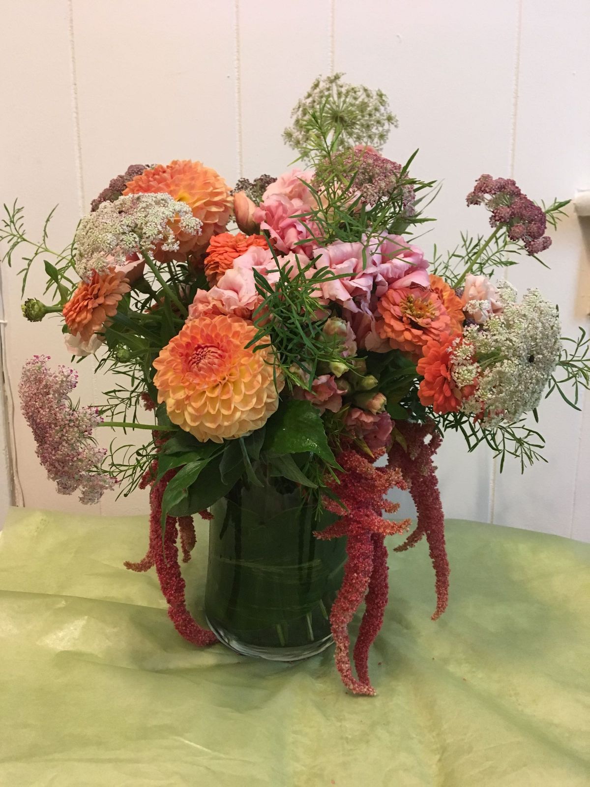 A vase filled with flowers is sitting on a table.
